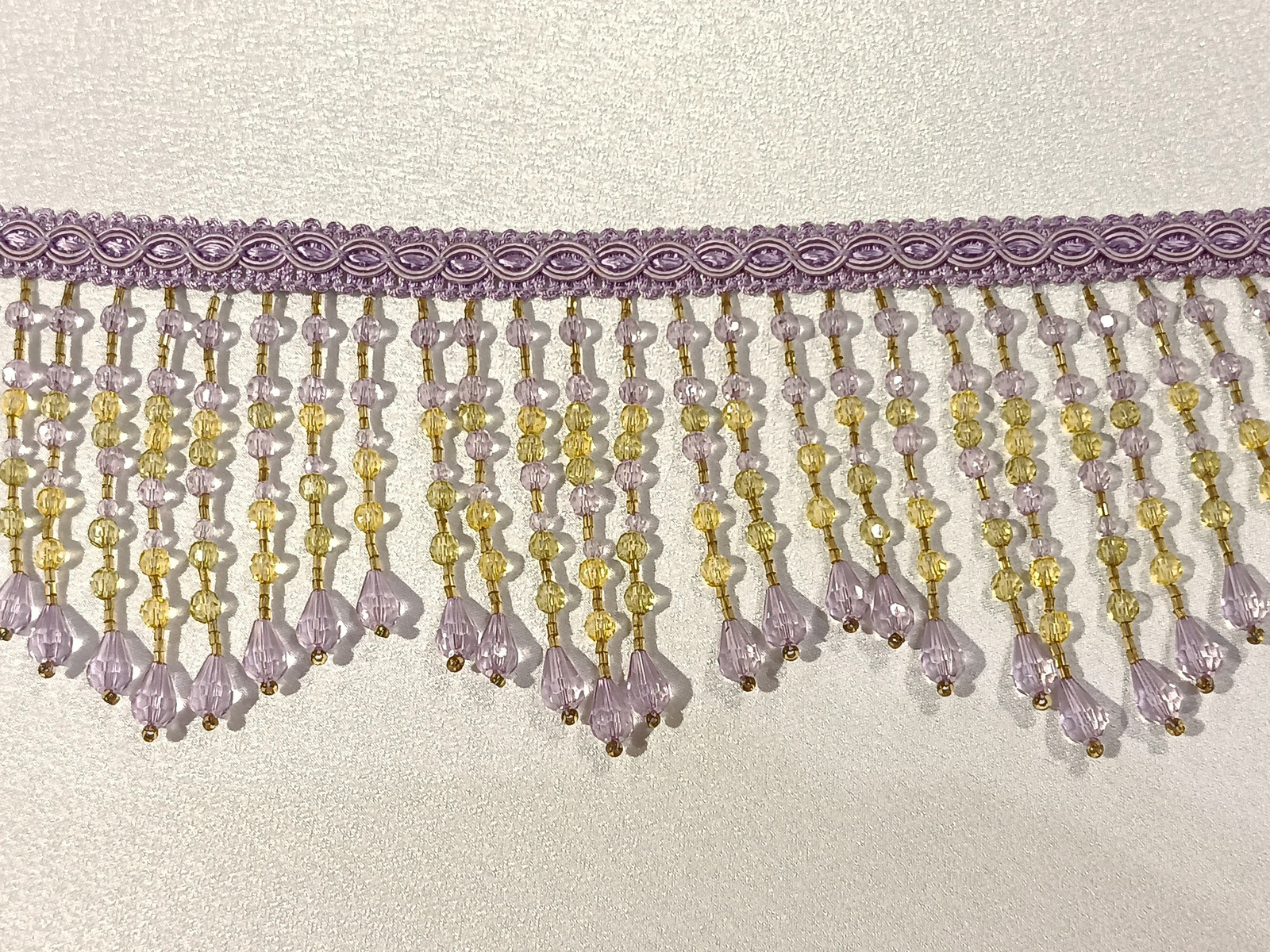 Fleco Rocalla Malva/Oro Picos 9,5 cms